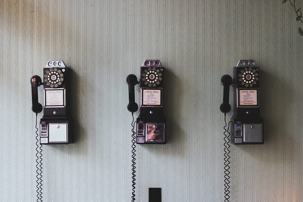old rotation phones on wall
