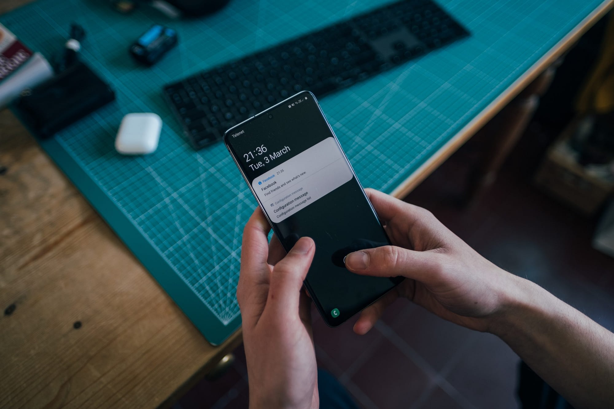 Person holding a cellphone with push notifications